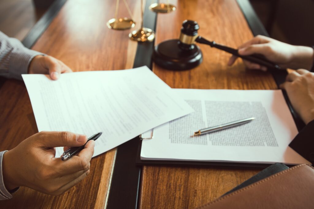 Client is bringing the documents to clarify the law to the lawyer at the prosecutor office.